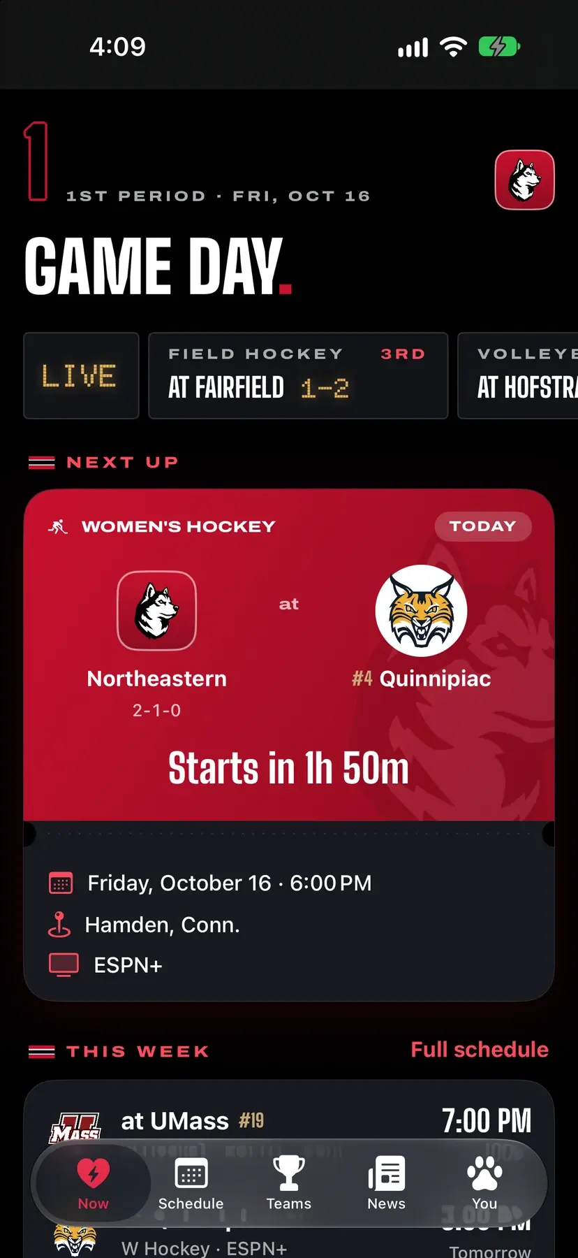 HuskyHowl 2.0 Now tab: Game Day header, a live field hockey score, and a red ticket-style card for women's hockey at Quinnipiac.